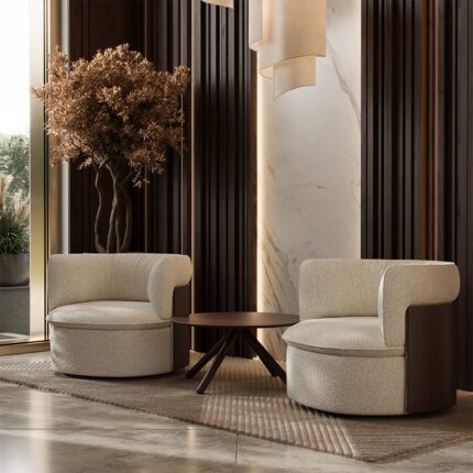 Kaks Oko tugitooli elegantse interjööriga lounge-alas, ümarate vormide ja pehme polstriga.